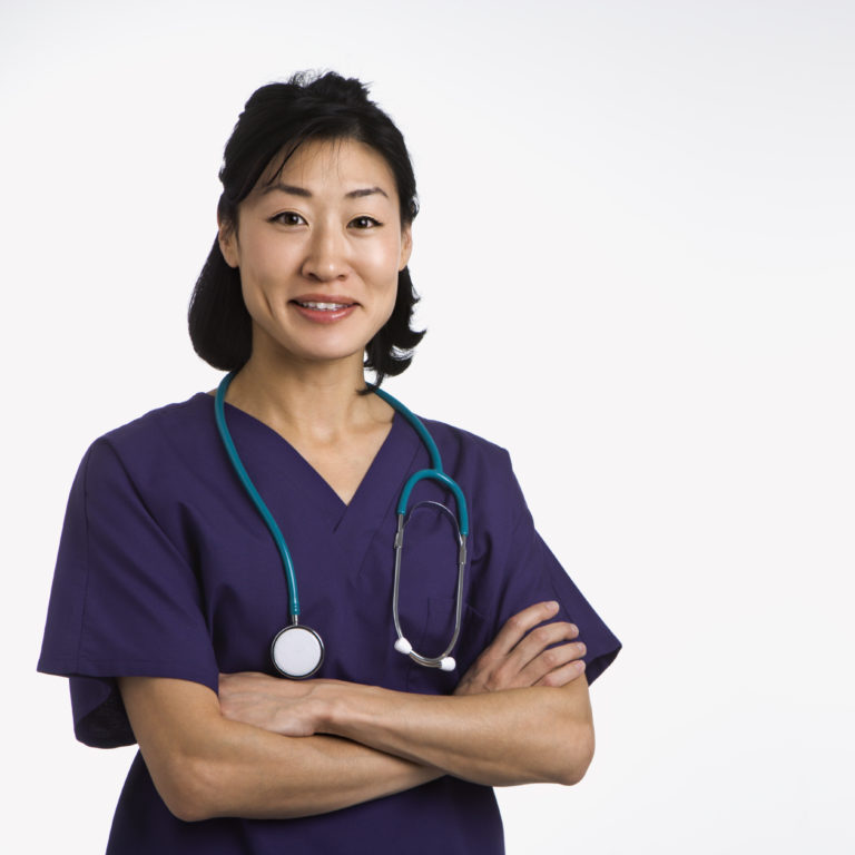 Doctor wearing purple scrubs and a stethoscope