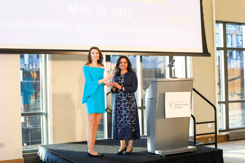 Woman receiving an award